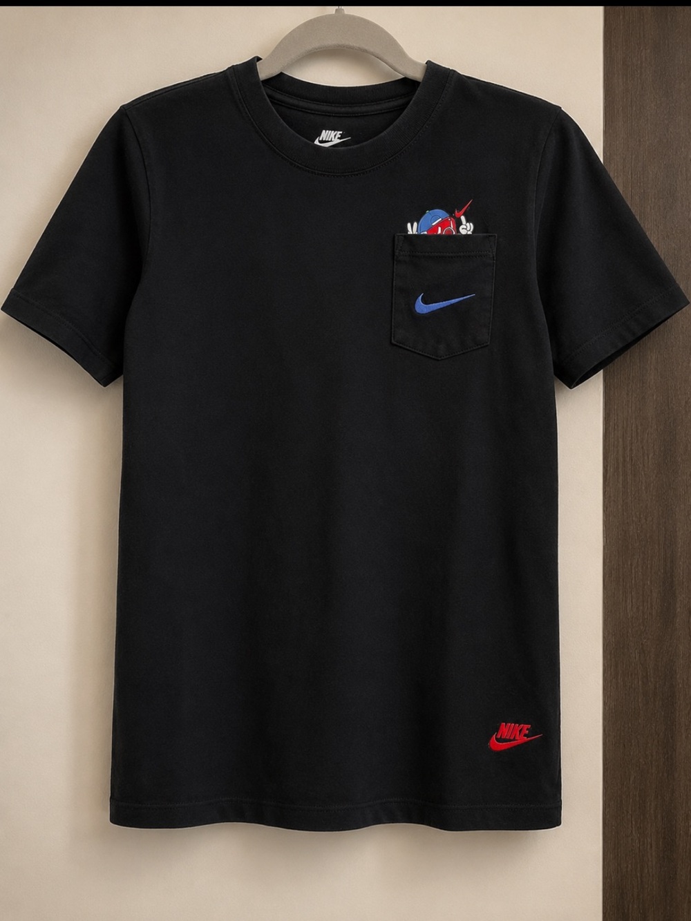 Nike Kids Black Tee with Blue Swoosh and Red Accent